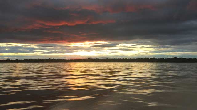Sunset over Amazon river